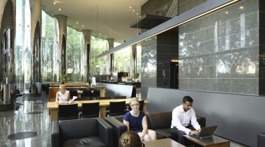 Seating area with black seats. - Seating area furniture, interior design, lobby, restaurant, black, gray
