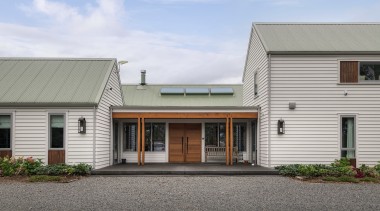 The design comprises three roofed forms containing different 