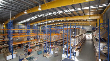 Interior of factory with yellow ceiling beams. - factory, industry, inventory, manufacturing, warehouse