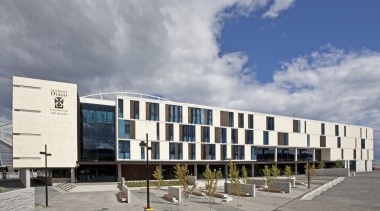 Exterior with white and glass wall. - Exterior architecture, building, commercial building, corporate headquarters, facade, mixed use, sky, gray