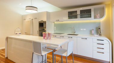 Contemporary kitchen with wooden flooring and white cupboards. cabinetry, countertop, cuisine classique, interior design, kitchen, property, real estate, room, orange, gray