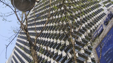 Low angle shot of office building. - Low architecture, building, facade, outdoor structure, roof, tree, black