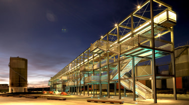 Exterior of watefront building at night. - Exterior architecture, building, city, commercial building, condominium, evening, facade, landmark, light, lighting, metropolis, metropolitan area, mixed use, night, reflection, residential area, sky, structure, urban area