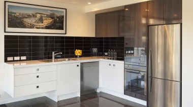 Kitchen with stainless fridge and white drawers and cabinetry, countertop, cuisine classique, interior design, kitchen, property, real estate, room, white