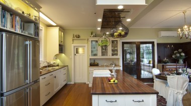 refrigerator, island and rangehood, floor and sink ceiling, countertop, interior design, kitchen, living room, real estate, room, brown