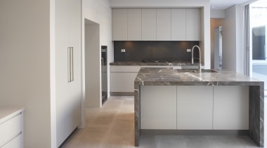 Grey and brown marble island benchtop, white walls, cabinetry, countertop, cuisine classique, floor, flooring, interior design, kitchen, real estate, room, wood flooring, gray