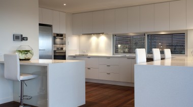 Contemporary kitchen with wooden flooring, white drawers and architecture, cabinetry, countertop, cuisine classique, floor, interior design, kitchen, real estate, gray