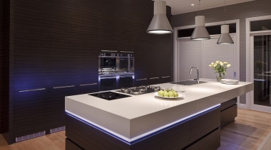 View of contemporary kitchen with brown wall, brown cabinetry, countertop, interior design, kitchen, room, under cabinet lighting, black