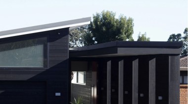 Exterior of townhouse painted in Resene colours, black architecture, building, facade, home, house, real estate, residential area, white, black