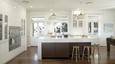 The white surfaces in this renovated kitchen appear cabinetry, ceiling, countertop, cuisine classique, floor, flooring, home, interior design, kitchen, real estate, room, wood flooring, gray, white