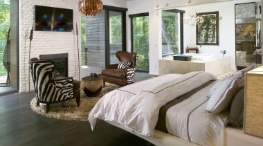 The master bedroom in this modern home is bed frame, bedroom, floor, flooring, furniture, home, interior design, living room, room, window, wood, gray