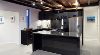 This kitchen, designed by the owner in conjunction countertop, interior design, kitchen, black, white