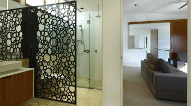 The glossy black acrylic privacy divider in this architecture, interior design, real estate, room, wall