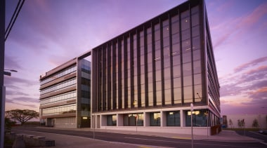 The new 5MR Lion offices in Sydney occupy architecture, building, commercial building, condominium, convention center, corporate headquarters, evening, facade, headquarters, landmark, metropolis, metropolitan area, mixed use, real estate, reflection, residential area, sky, skyscraper, structure, purple, red