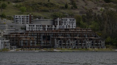 Hilton Queenstown Hotel joinery by Aluminium Systems body of water, cottage, home, house, lake, real estate, reflection, river, sky, tree, water, black