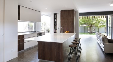 White lacquered cabinets are contrasted by walnut veneer countertop, floor, flooring, house, interior design, kitchen, real estate, room, gray