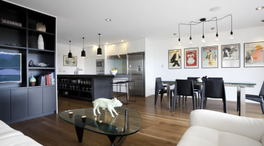 The island in this open-plan family living area apartment, interior design, living room, room, white