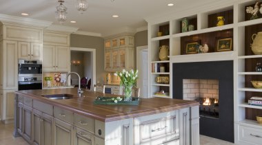 A large, multifunctional island is the centerpiece of cabinetry, countertop, cuisine classique, interior design, kitchen, room, gray, brown