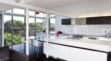 This light-filled kitchen is orientated to harness the countertop, interior design, kitchen, real estate, gray, white