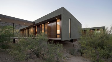 A covered walkway bridges the landscape between the architecture, facade, home, house, landscape, real estate, white, brown