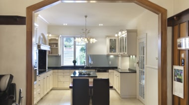 The island tabletop in this contemporary classic kitchen cabinetry, ceiling, countertop, cuisine classique, interior design, kitchen, property, real estate, room, gray
