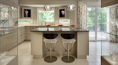 An angled exterior wall on this new kitchen, cabinetry, countertop, cuisine classique, floor, interior design, kitchen, room, table, gray, brown