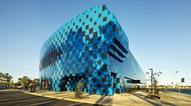 Desert storm  Wanangkura Stadium by ARM Architecture architecture, building, corporate headquarters, daytime, landmark, metropolitan area, sky, structure, teal
