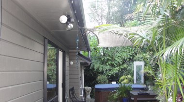 All-weather coverage  outdoor solutions from Awesome Awnings home, house, property, real estate, roof, tree, gray