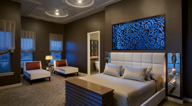 This master bedroom is unrecognizable from the original. bedroom, ceiling, home, interior design, living room, room, suite, wall, brown, black