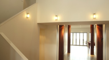 The interior reflects strong attention to detail that apartment, architecture, ceiling, daylighting, estate, floor, flooring, hall, handrail, hardwood, home, house, interior design, laminate flooring, lighting, lobby, loft, property, real estate, stairs, wall, wood, wood flooring, brown, orange