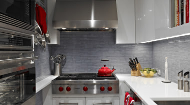 A narrow shelf next to the cooktop is countertop, interior design, kitchen, room, gray, black