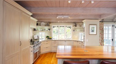 Open shelving provides extra storage and gives a cabinetry, ceiling, countertop, cuisine classique, estate, floor, hardwood, home, house, interior design, kitchen, property, real estate, room, wood, wood flooring, gray, orange