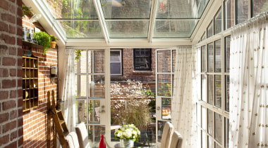 This kitchen in a Federal-style townhouse opens to daylighting, home, house, interior design, orangery, outdoor structure, patio, porch, roof, window, brown, white