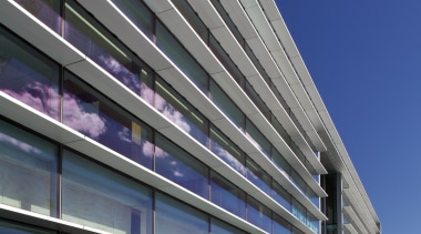 New seismic structural systems technology is transforming the architecture, building, commercial building, condominium, convention center, corporate headquarters, daylighting, daytime, facade, headquarters, infrastructure, line, metropolis, metropolitan area, mixed use, residential area, sky, structure, urban area, gray, blue