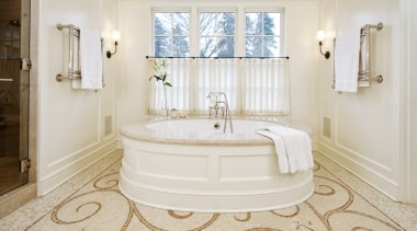 A large round tub with a marble surround bathroom, bathtub, estate, floor, flooring, home, interior design, plumbing fixture, property, real estate, room, tile, wall, window, wood flooring, white