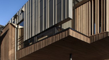 Titanium zinc cladding on modern building.  Titanium architecture, brutalist architecture, building, commercial building, corporate headquarters, facade, home, house, mixed use, residential area, siding, black