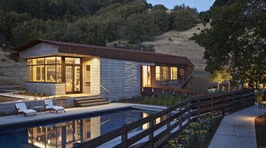 Raw materials are a feature of this rural architecture, cottage, estate, home, house, landscape, lighting, property, real estate, reflection, resort, villa, water, black