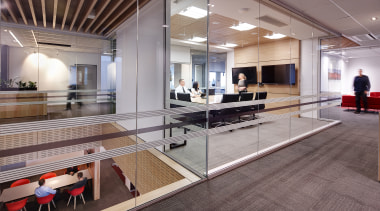 The large stairway void, centrally located hubs and floor, flooring, interior design, lobby, wood, gray