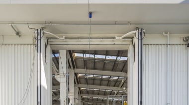 The Wiri Depot features a number of firsts building, structure, transport, vehicle, gray