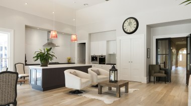 This contemporary open-plan kitchen and living area by ceiling, floor, flooring, hardwood, interior design, laminate flooring, living room, real estate, room, wood flooring, gray