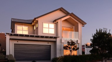 The Landing, a two-storey, weatherboard show home was building, elevation, facade, home, house, property, real estate, residential area, roof, siding, window, black, blue