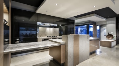 ELiving areas and kitchen are seamlessly integrated in countertop, interior design, kitchen, gray, black