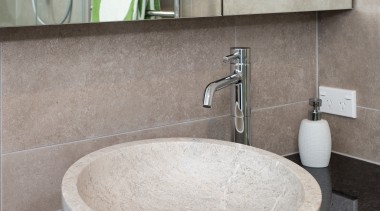 The homeowners wanted this bathroom to have a bathroom, bathroom sink, bidet, ceramic, countertop, floor, interior design, plumbing fixture, room, sink, tap, tile, toilet seat, gray