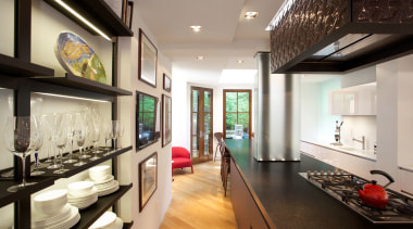 To disguise two structural columns that remained in ceiling, interior design, gray, black