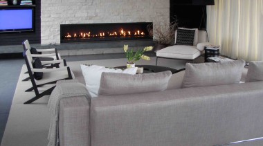 Eye-catching fireplaces are designed and constructed by architectural floor, flooring, furniture, interior design, living room, luxury vehicle, table, wall, gray