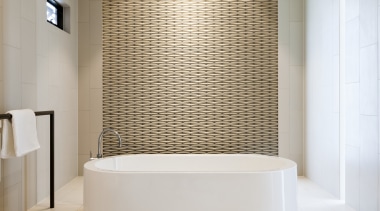 A freestanding bath with textured tilework on the architecture, bathroom, ceiling, daylighting, floor, flooring, interior design, room, tile, wall, gray