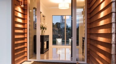 Cedar weatherboards line the entry to this new door, home, interior design, property, real estate, window, brown, orange