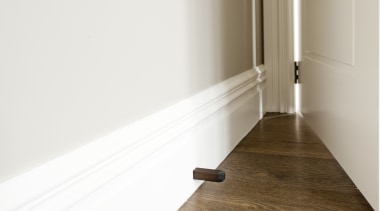 Chant customisable residential doorstop in Weathered Brass from floor, flooring, furniture, hardwood, interior design, laminate flooring, light, product design, property, wall, wood, wood flooring, wood stain, white