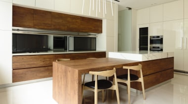 Stained pine wood cabinets make a bold textural cabinetry, countertop, cuisine classique, floor, flooring, furniture, hardwood, interior design, kitchen, real estate, table, wood, wood flooring, white