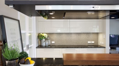 Positioning the main work area so it faces countertop, glass, interior design, kitchen, gray, black